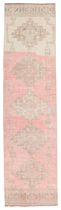 Full overhead view of the pink and beige geometric Anatolian runner rug