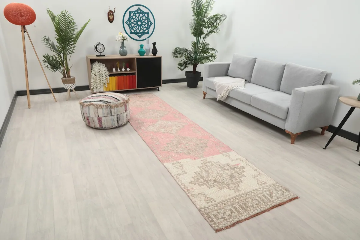Angle view of the runner rug in a room setting, showing its length and colors