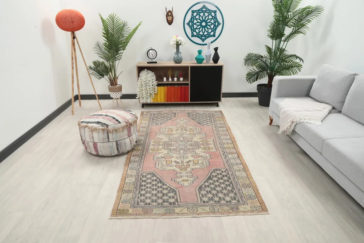 Rose Anatolian rug placed in a living room setting with modern furniture