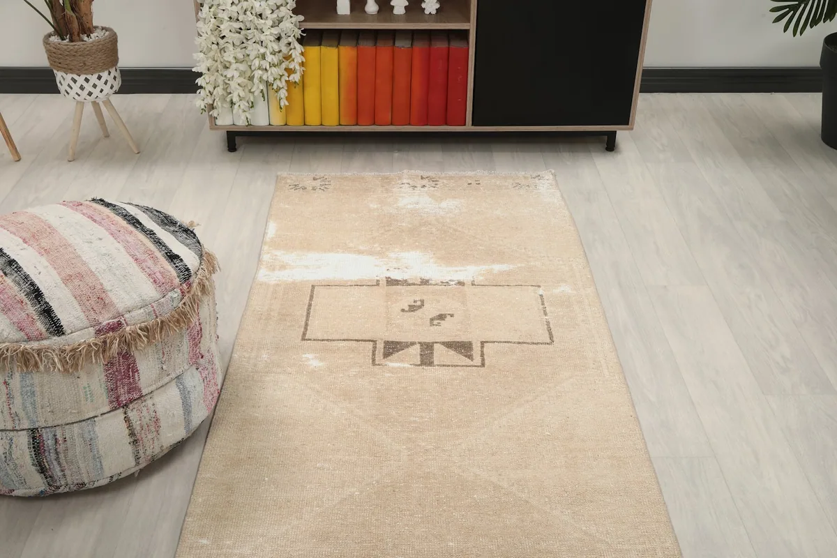 View of the runner rug stretching from the foreground towards a cabinet, emphasizing its length in a room