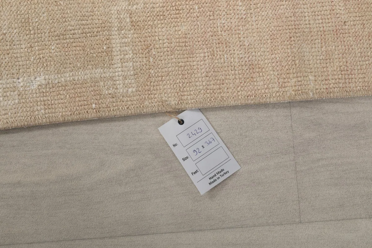 Product tag attached to the rug, displaying item number, size, and origin information