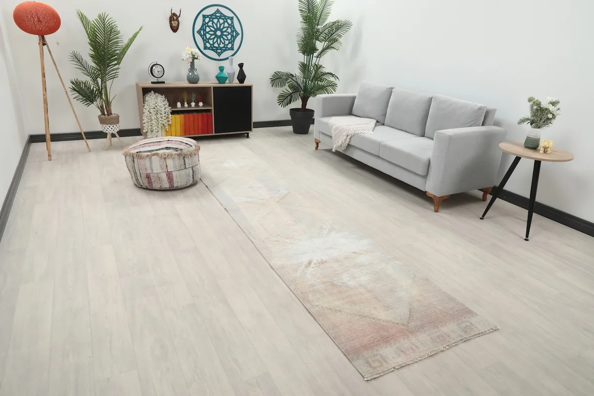 Angled view of the soft rose runner rug in a modern living space with light-colored flooring