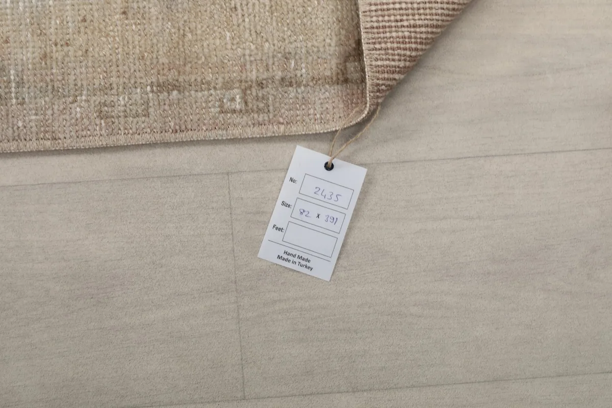 Product tag displaying the rug's dimensions and origin: Hand Made in Turkey