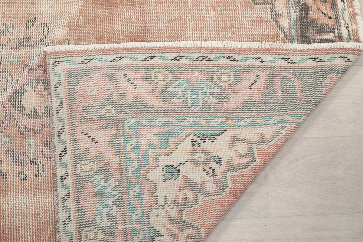 Close-up of the rug's back, showing the consistent knotting and structure.