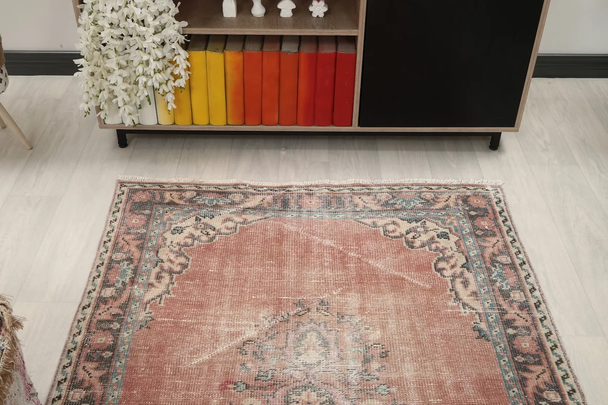 Overhead view of the rug in a room setting, showing its overall shape and pattern.