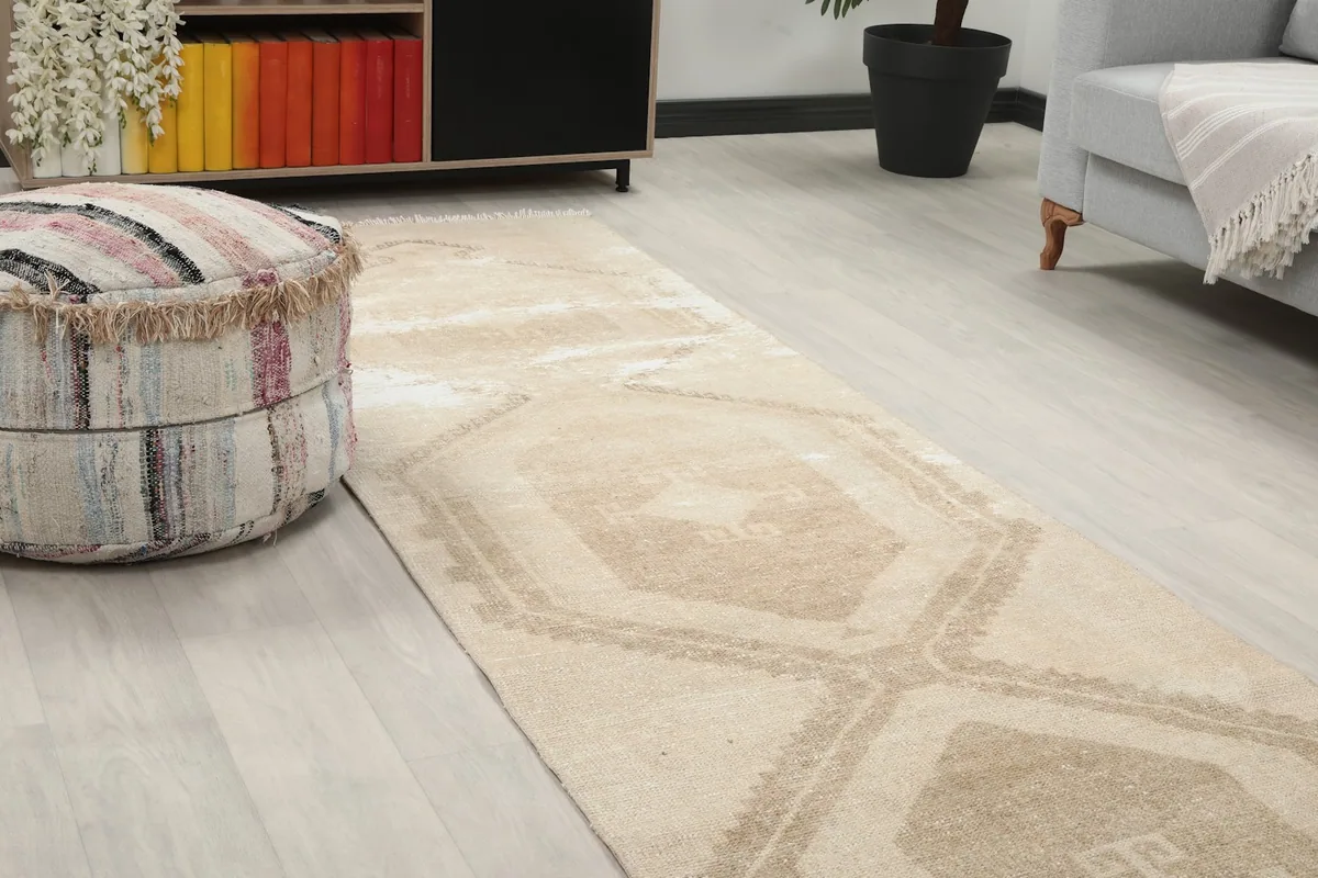 Close-up angled view of the runner rug showing geometric patterns and texture