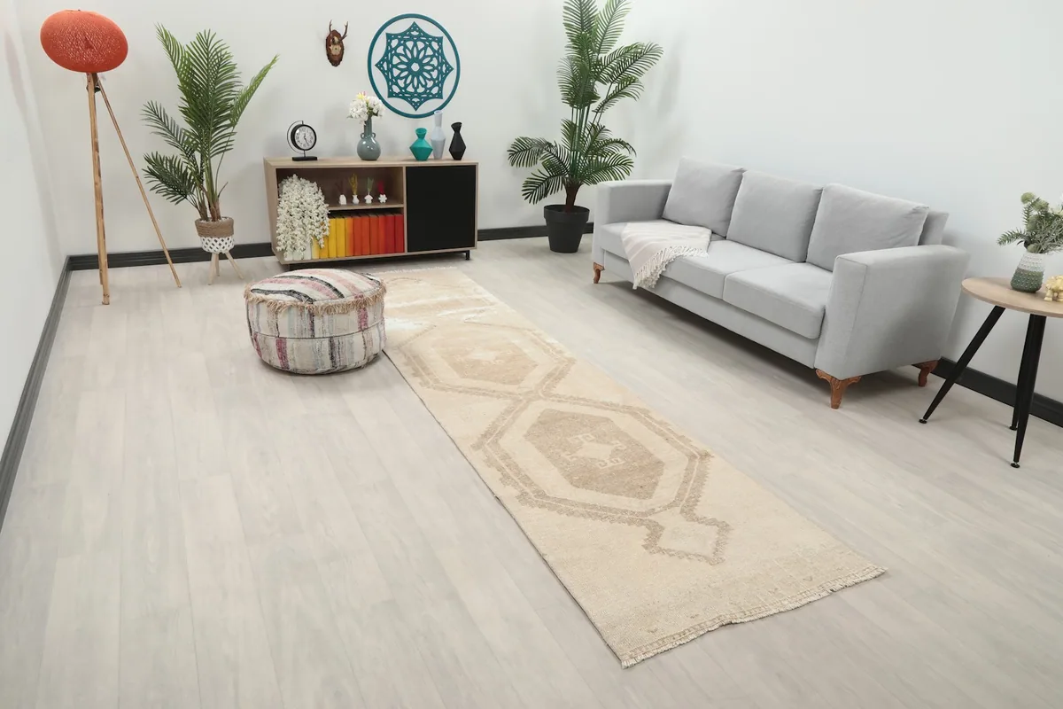 Full view of the beige and brown runner rug in a room setting