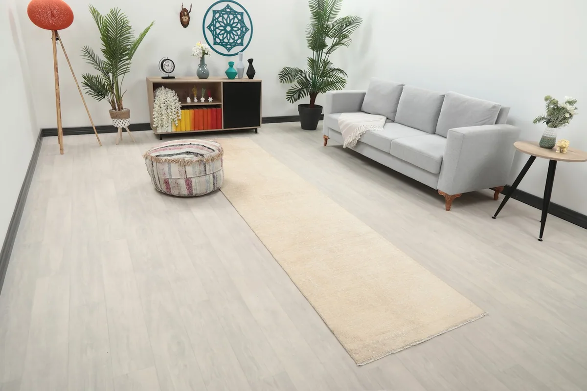 Overhead view of the beige runner rug in a modern living space