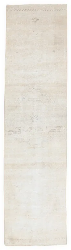 Full top view of the 2'10" x 11'8" beige vintage Anatolian runner rug on a white background.