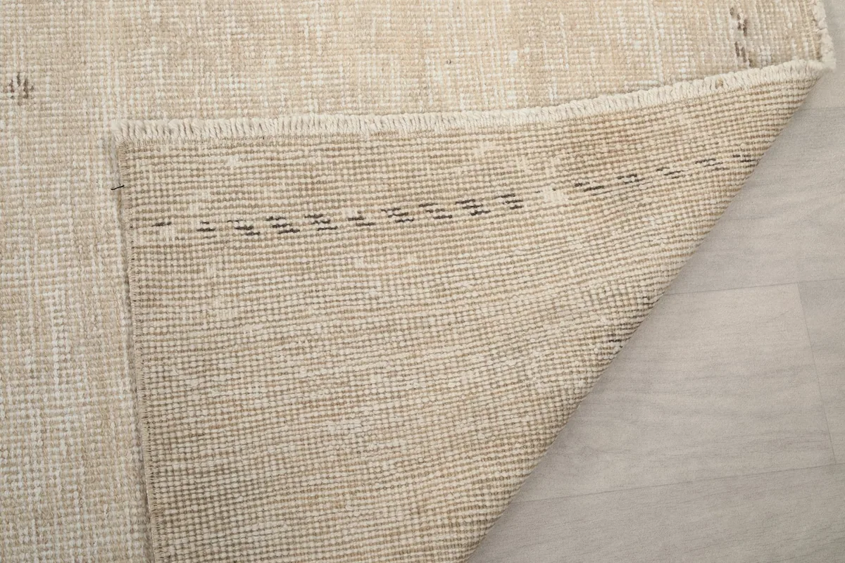 Another view of the rug's back, detailing the sturdy foundation and the reverse side of the knots.