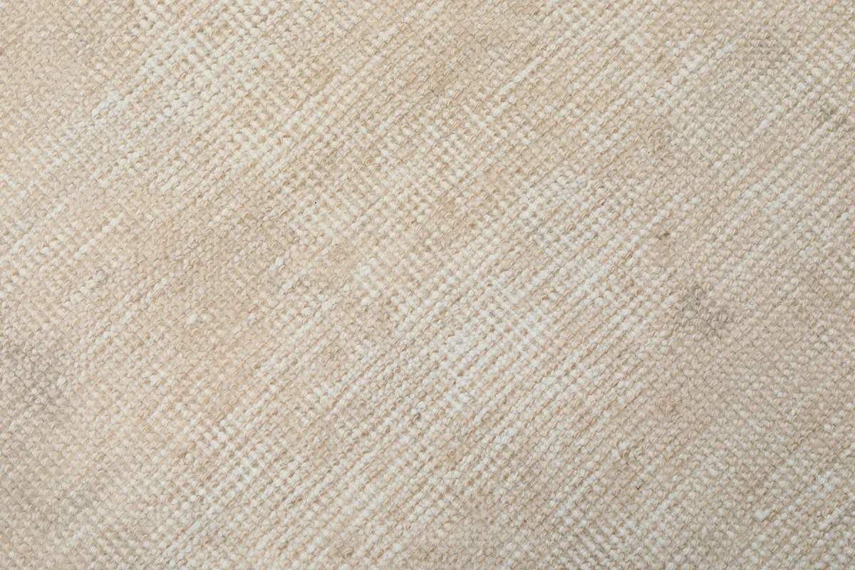 Tight close-up shot showing the low wool pile and tight knotting of the vintage rug