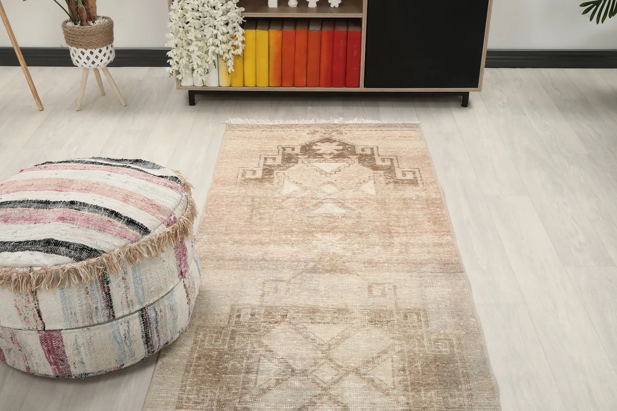 Overhead view of one end of the runner rug in a room, showing its placement relative to furniture