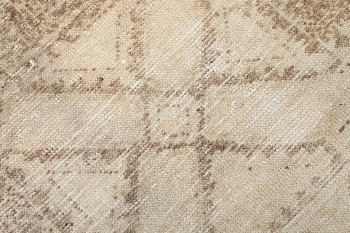 Close-up of the low wool pile and intricate knotting, revealing the vintage wear and texture