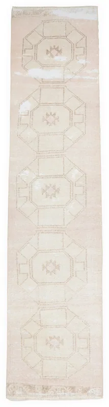 Full overhead view of the rose beige geometric vintage runner on a white background