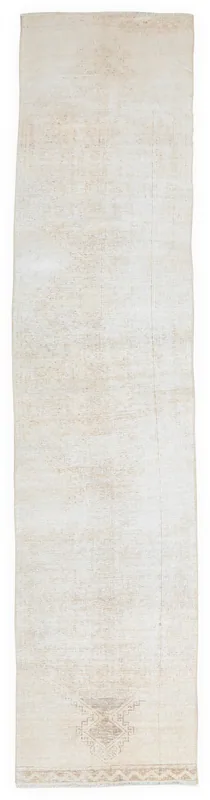 Full overhead view of the 2'8" x 12'9" cream vintage Anatolian runner rug