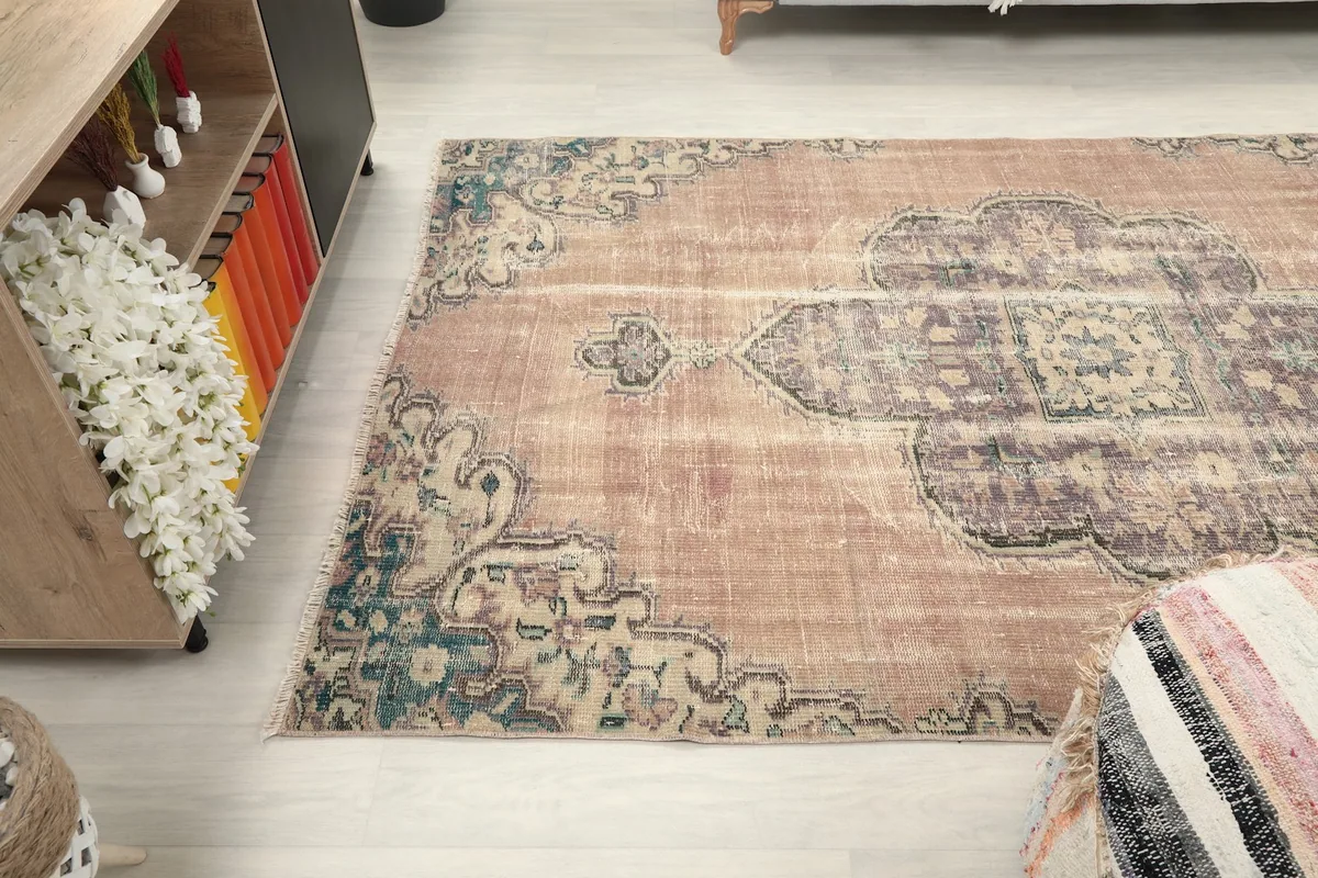 View of the rug from another angle, highlighting its vintage character
