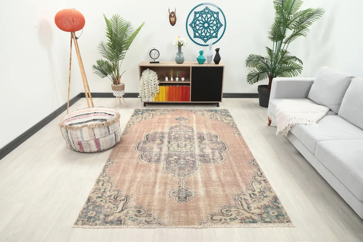Vintage Anatolian rug displayed in a bright living room setting