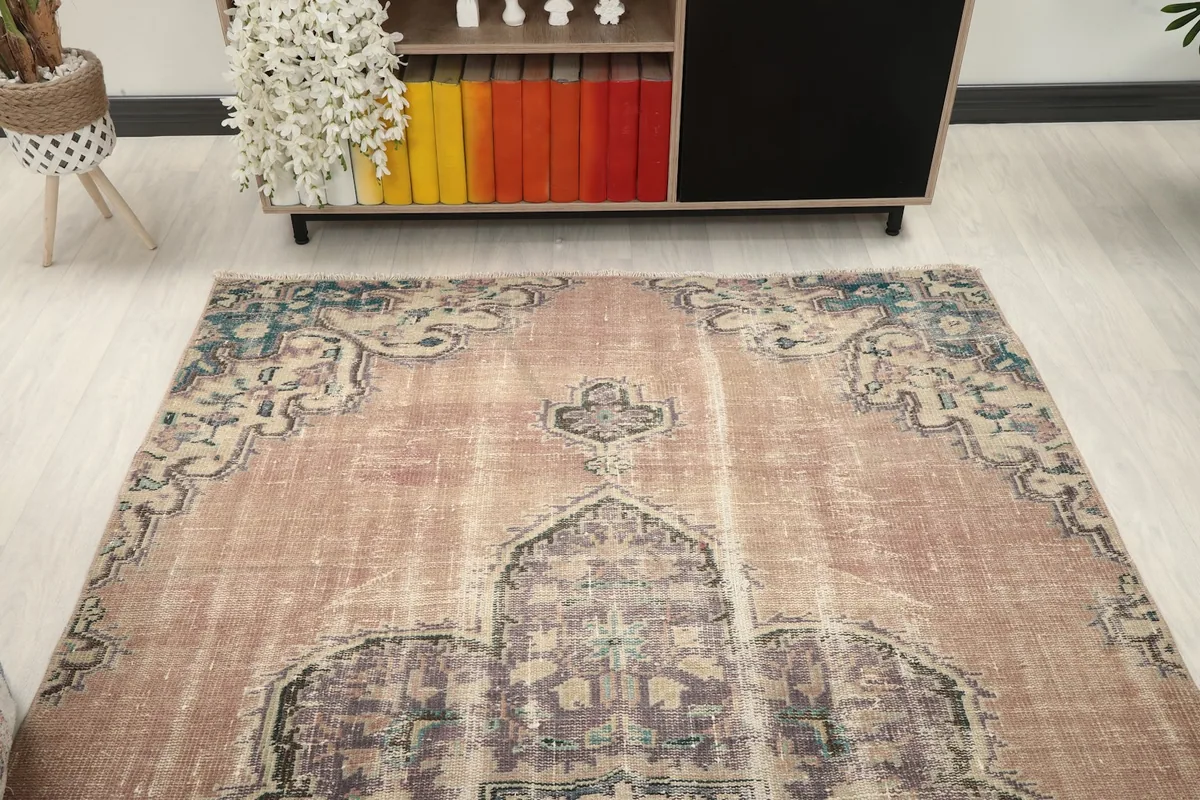 Overhead view of the rug in a room, showing its placement in front of a cabinet