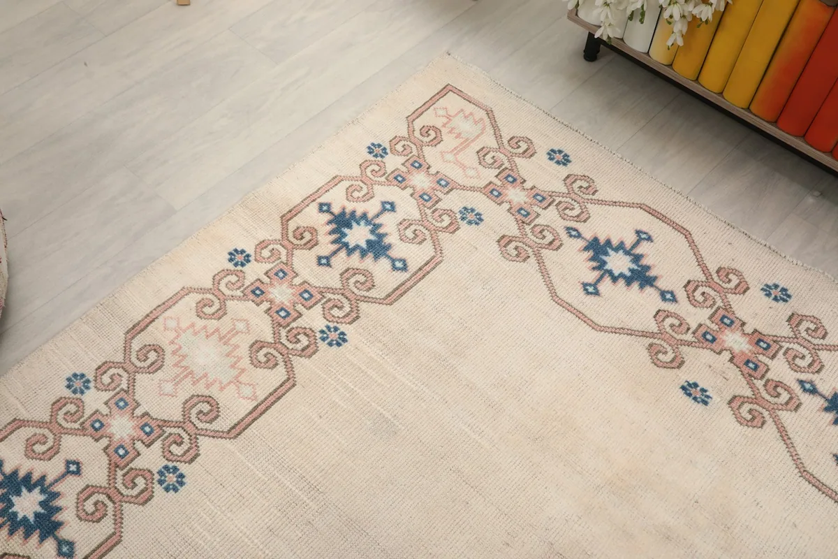 Another angle shot emphasizing the intricate tribal patterns and colors within the rug's border
