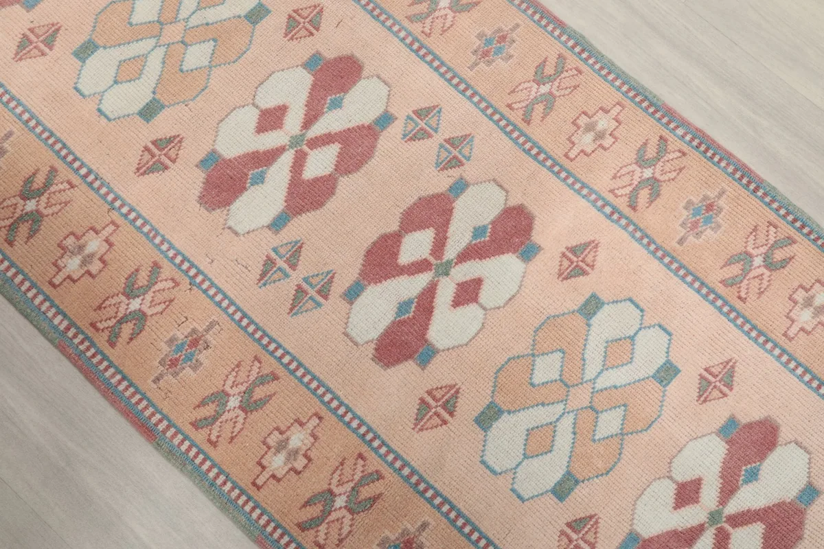 Angled view highlighting the repeating geometric patterns along the runner rug