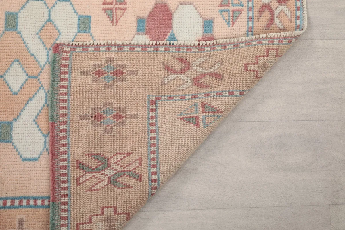 Close-up of the back of the hand-knotted runner rug, showing the foundation