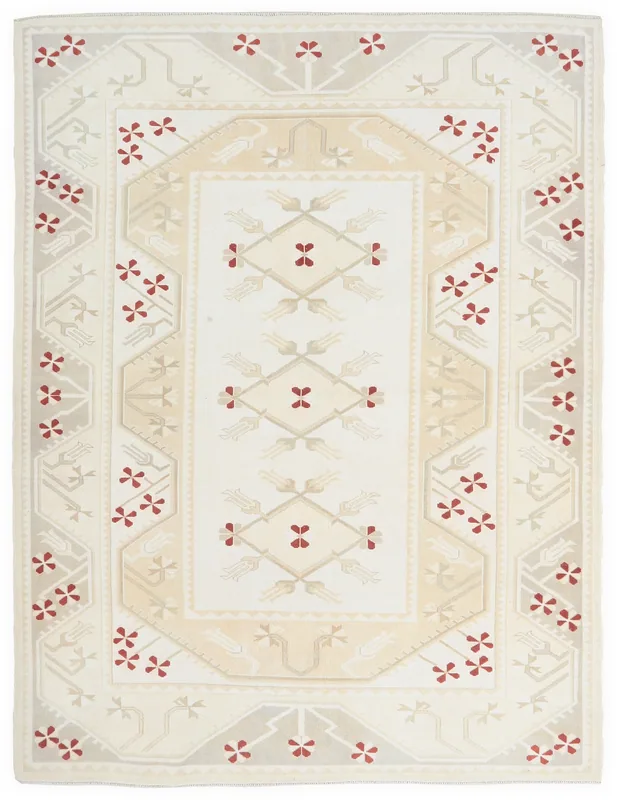 Full top view of the ivory, red, and beige Anatolian tribal rug on a white background.