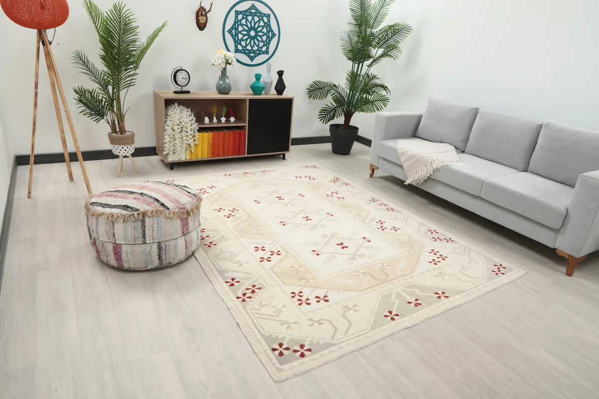 Angle view of the ivory red rug in a modern living space, showcasing its size and colors.