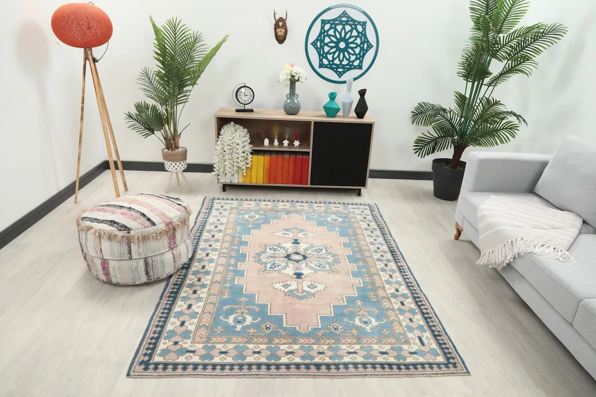 Area rug displayed in a bright living room setting with a light sofa