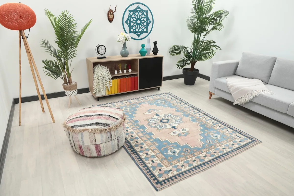 Vintage rug shown in a room from an elevated angle, showcasing its placement