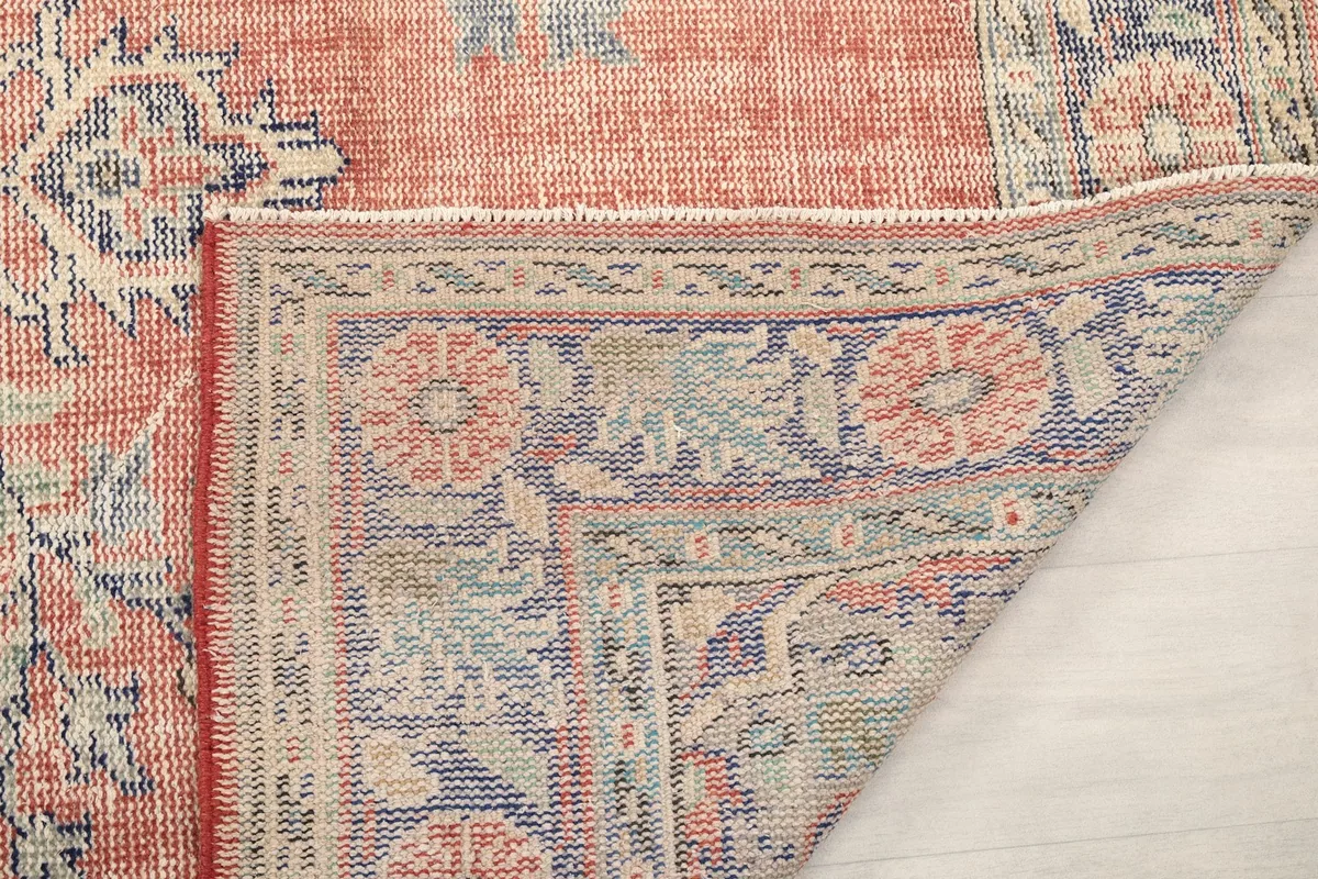 Another folded corner view, highlighting the wool pile and cotton foundation