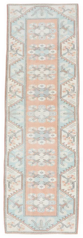 Full top view of the peach and blue Anatolian vintage runner on a white background