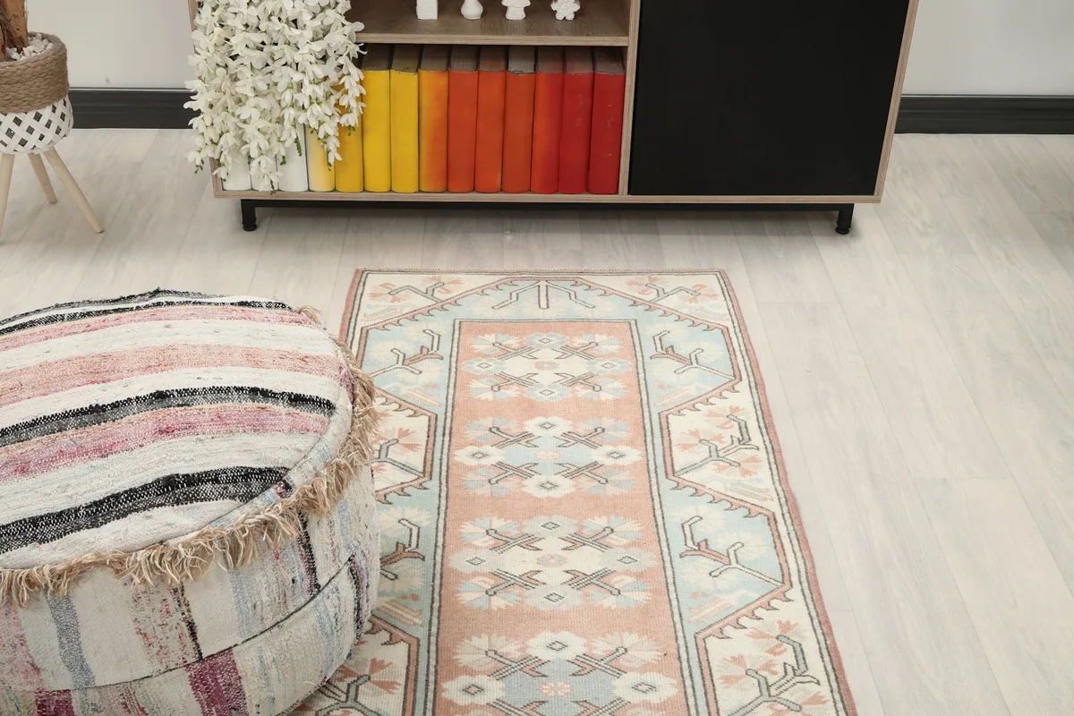 Overhead view of the vintage runner rug in a room, showing its placement relative to furniture
