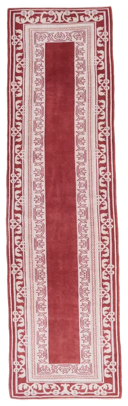 Full top view of the vintage red and cream Anatolian runner rug on a white background.