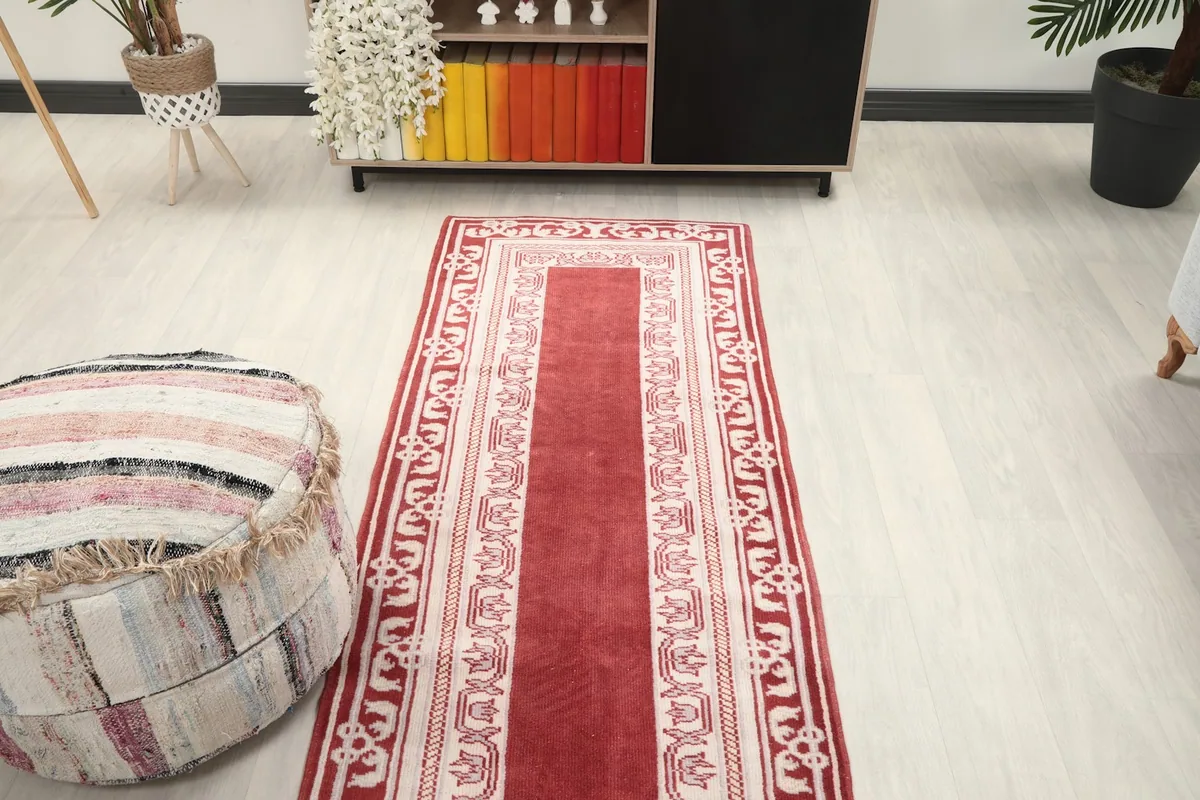 Overhead view of the red runner rug in a room, capturing its placement and overall design.