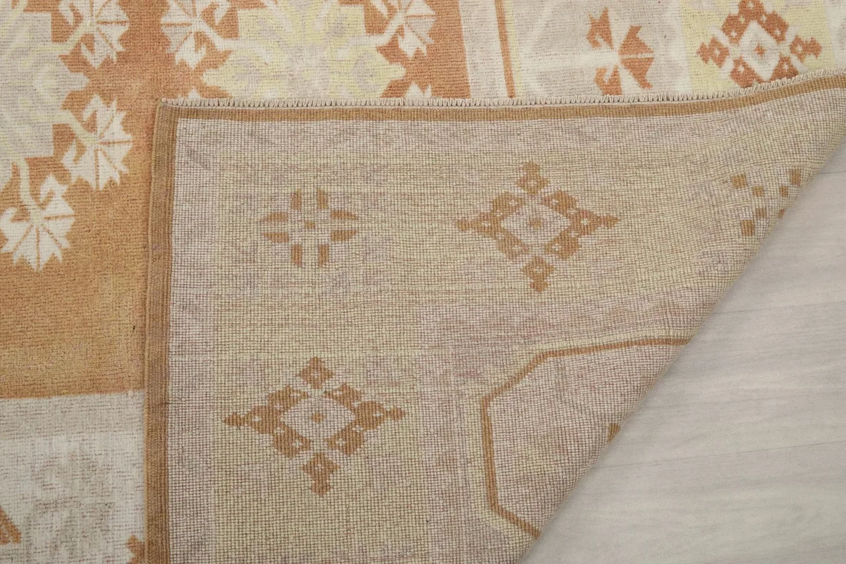 Detailed view of the rug's back, showing the consistent knotting and material structure.