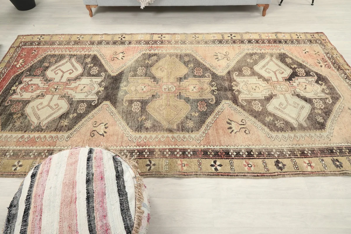 Broad overhead view of the entire rug on a light floor, emphasizing its large size and pattern flow