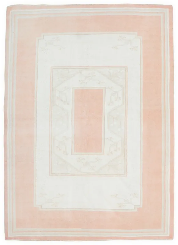 Full overhead view of the pink and ivory vintage Anatolian rug on a white background