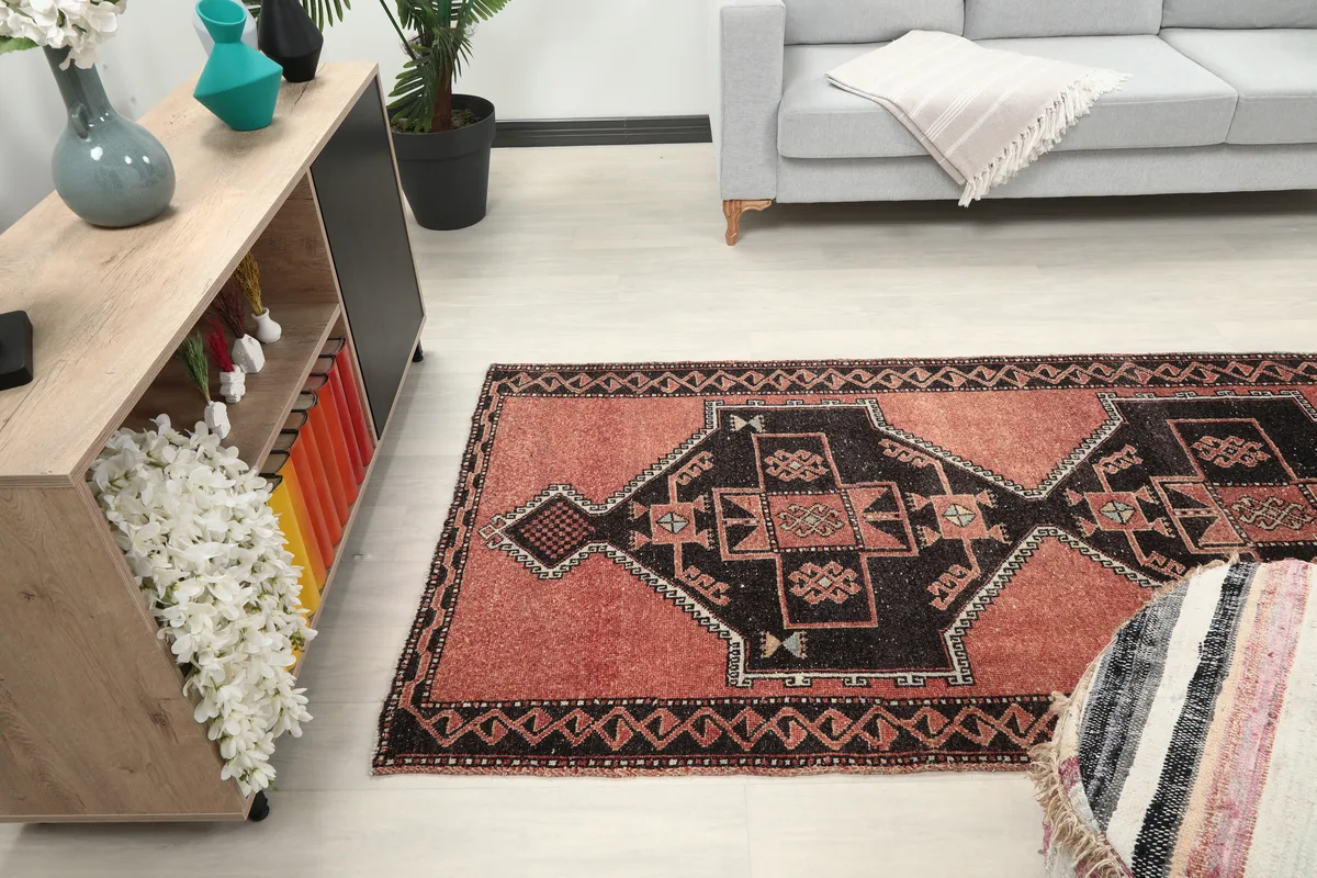 Rust Geometric Anatolian Runner extending through a room, showcasing its runner dimensions.