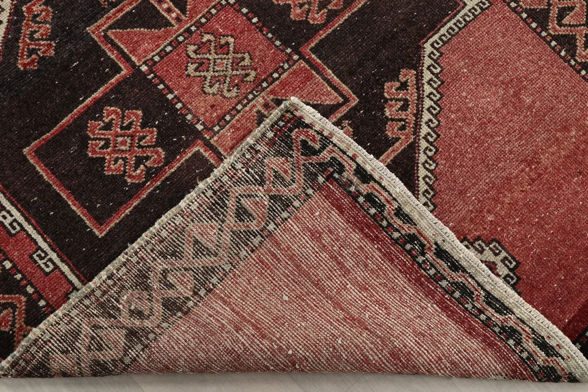 Underside view of the Rust Geometric Anatolian Runner, revealing the hand-knotted cotton foundation.
