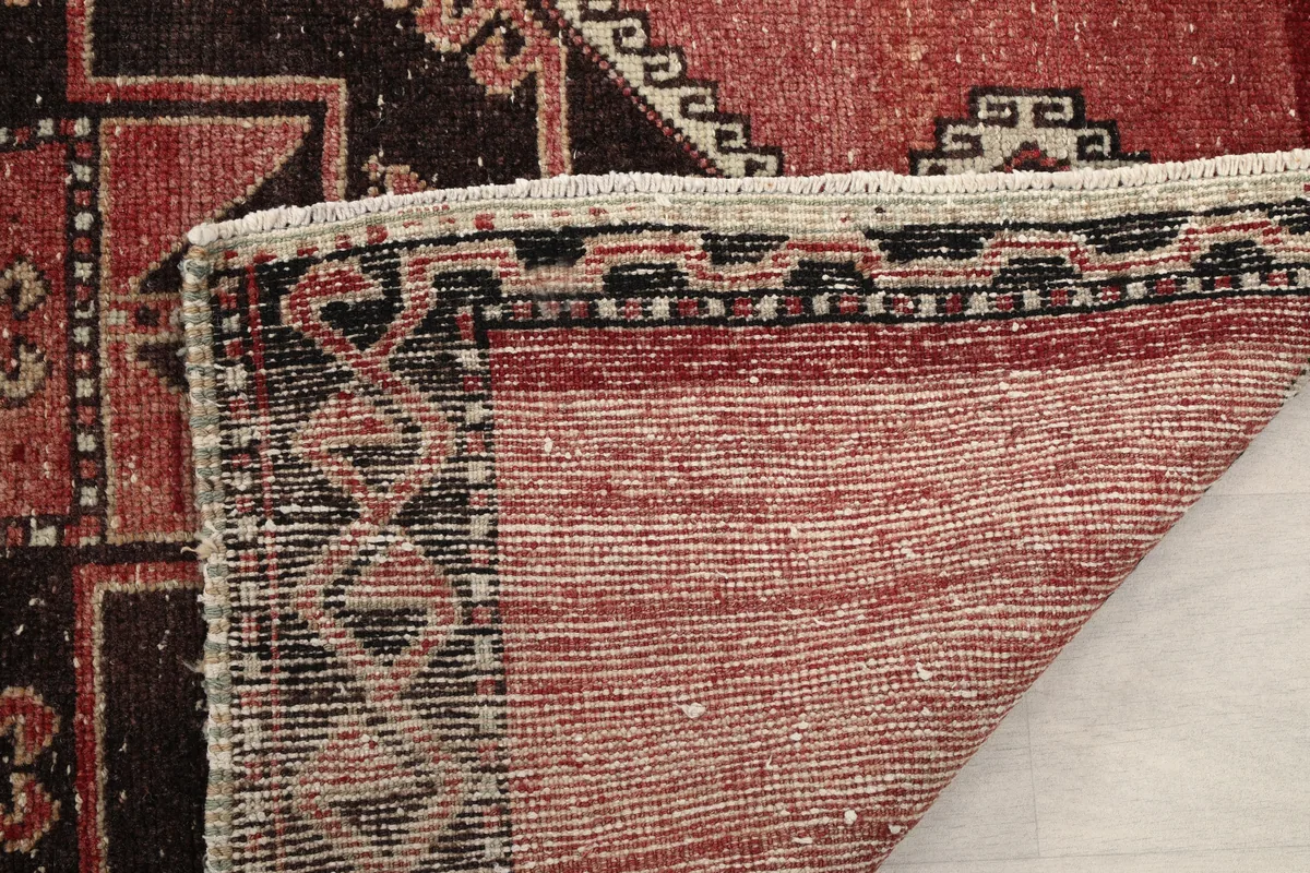 Close-up of the back of the Rust Geometric Anatolian Runner, showing the quality of craftsmanship.