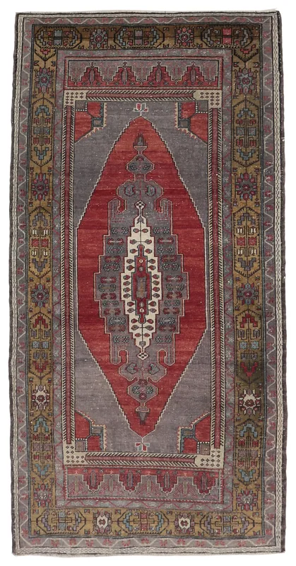 Full top view of the 3'7" x 7'4" vintage Anatolian rug with red medallion on gray field
