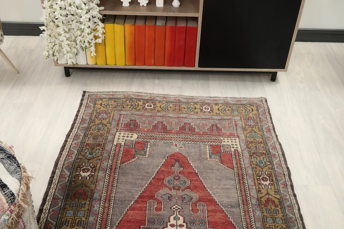 Overhead view of the rug in a room, showing its full length and design