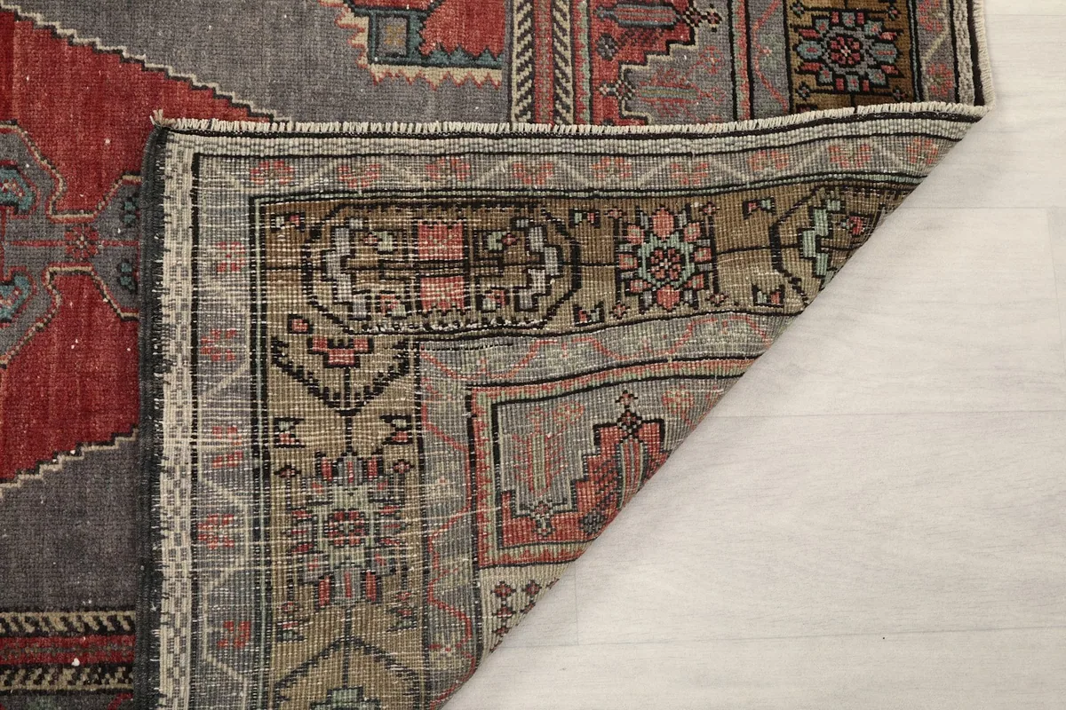 Detailed view of the hand-knotted construction on the back of the rug