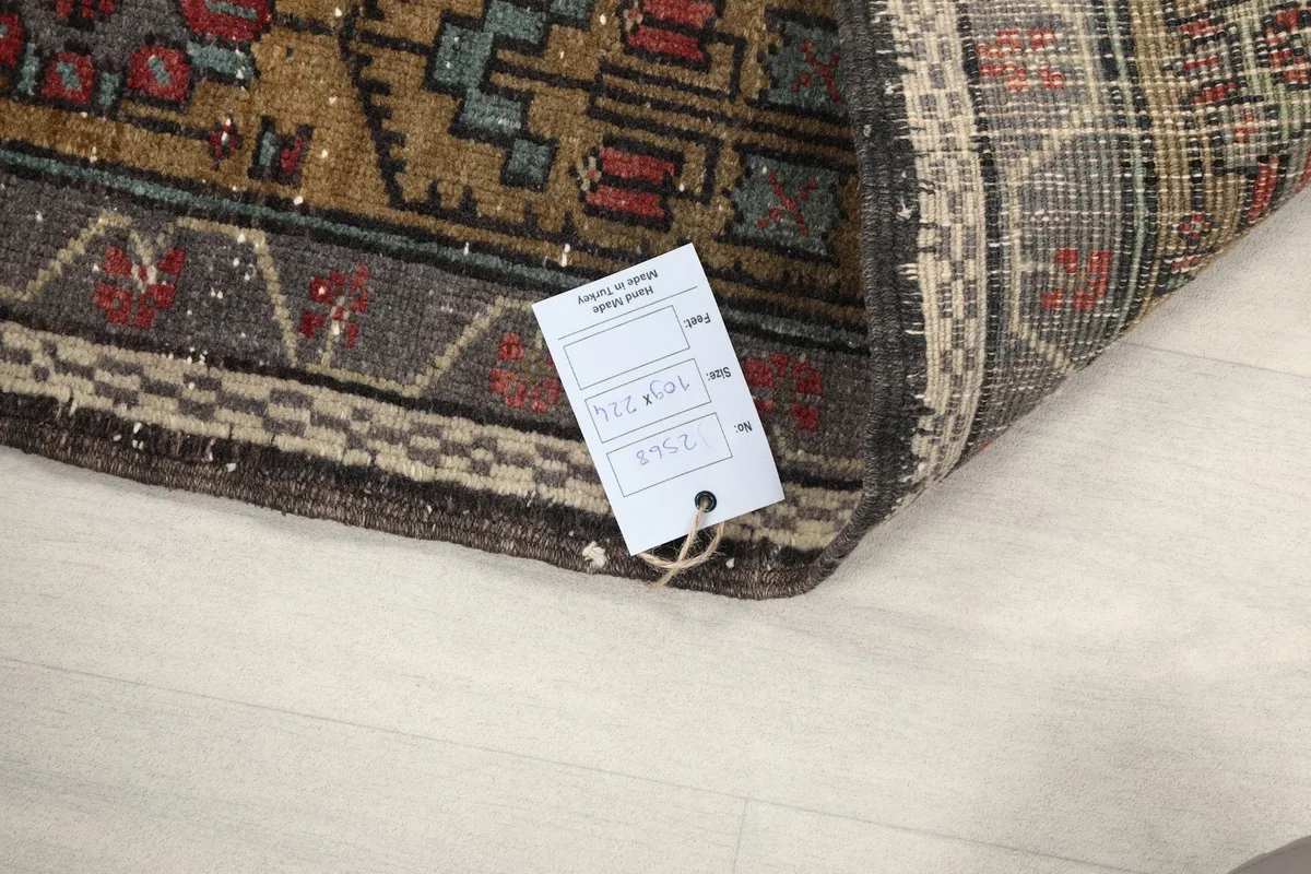 Rug corner with product tag showing details like size and material