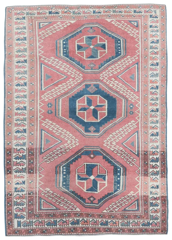 Full overhead view of the rose and blue geometric vintage Anatolian rug