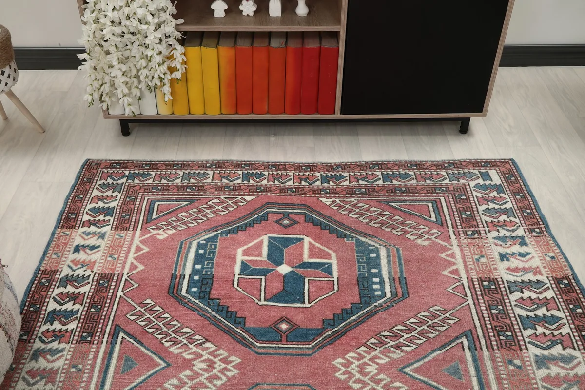 View of the rug from above, focusing on the upper half and surrounding room elements