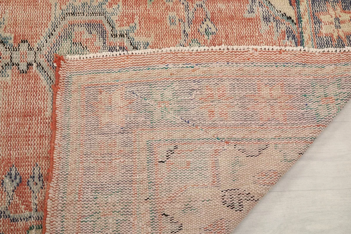 Closer view of the rug's back, revealing the hand-knotted construction