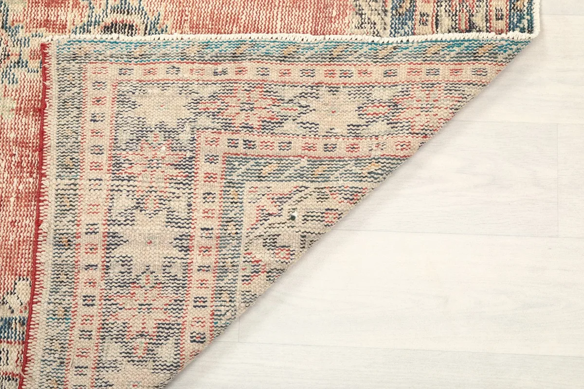 Another folded corner, providing a view of the rug's construction and foundation