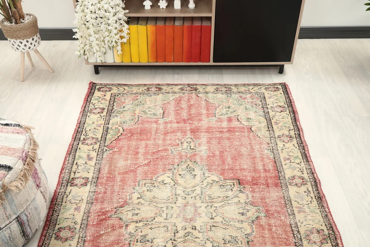 Overhead view of the rug in a room, showcasing its full design and colors from above