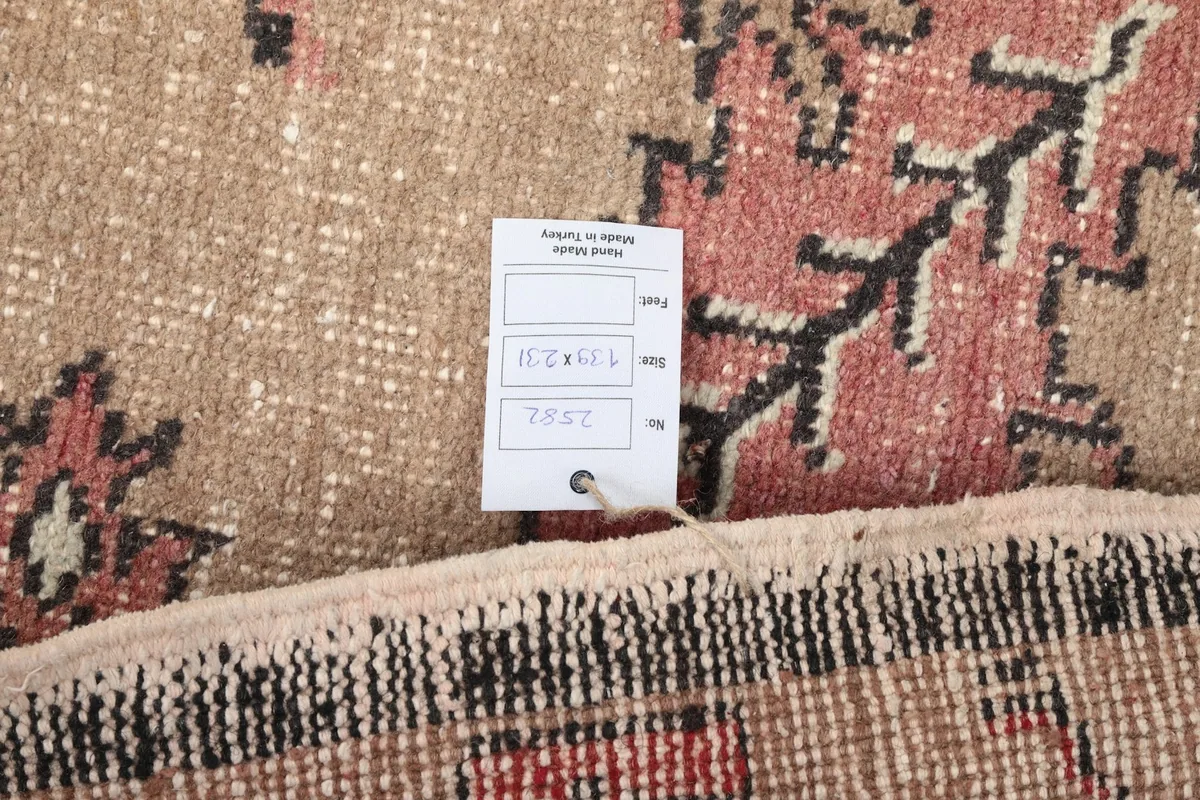 Tag on the back of the rug, showing size and origin information